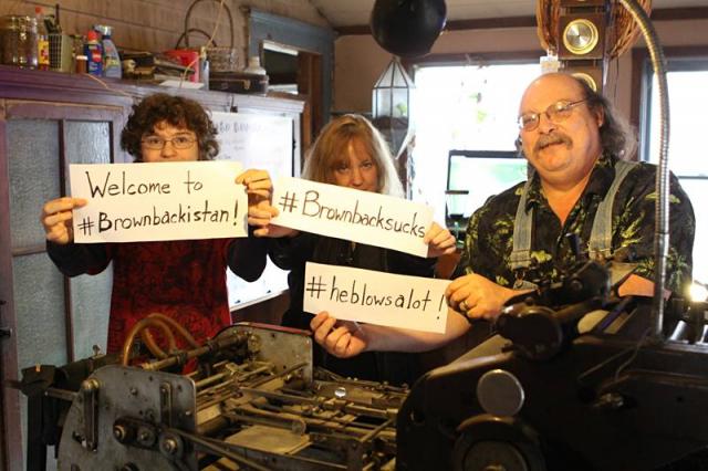 Kristi, Mike and their son Tristan together with the family printing press, tell it like it is about Kansas politics