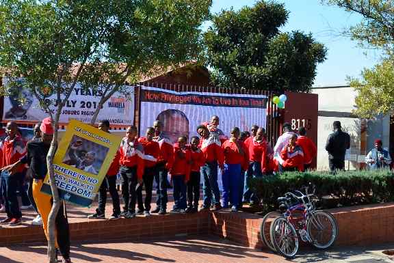 Schoolchildren visit Mandela House Museum in Soweto, where the South African leader lived before going underground (Linn Washing