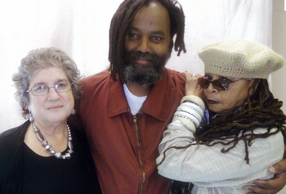 Mumia, off death row but fighting to escape life in prison, with attorney Rachel Wolkenstein and his wife Wadiya Jamal