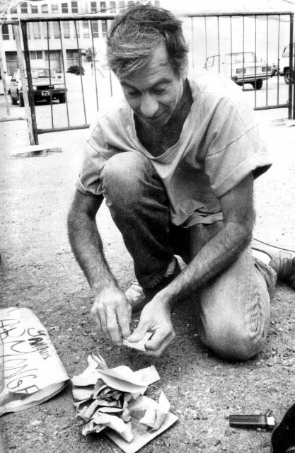 Author Ron Ridenour burns his US Passport in front of US Special Interests Section building in Havana