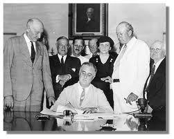 Pres. Franklin Roosevelt signs the Social Security Act into law