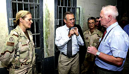 Defense Secretary Donald Rumsfeld at Abu Ghraib, where he ordered rough treatment for Iraqis.