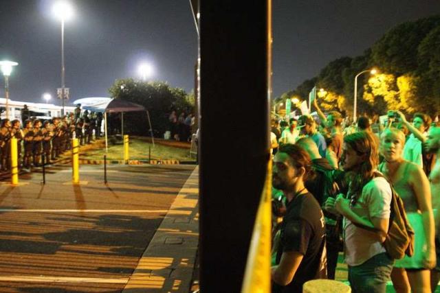 Anti-Hillary protesters, angry Sanders backers and Black Lives Matter activists mass at convention gate facing riot police arrayed inside the convention 'green zone'