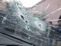 The tight pattern of bullet holes in the windshield shows the precision of Davis's shots at his victims.